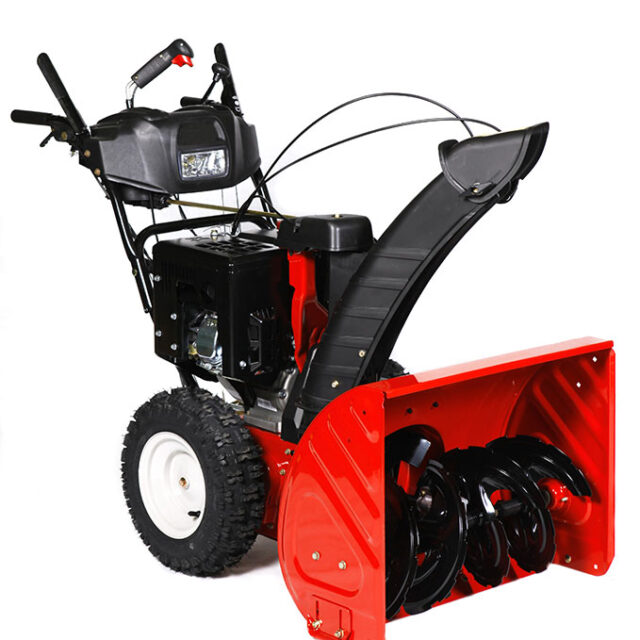 A red snow blower, snow thrower, snow removal equipment isolated on a white background.